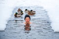 Beautiful boy bathing and swimming in the cold water Royalty Free Stock Photo