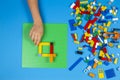 Vilnius, Lithuania - February 23, 2019. Children hand play with colorful lego blocks on the table Royalty Free Stock Photo