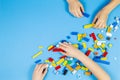 Vilnius, Lithuania - February 23, 2019. Children hands play with colorful lego blocks on the table