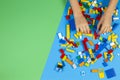Vilnius, Lithuania - February 23, 2019. Children hands play with colorful lego blocks on the table Royalty Free Stock Photo