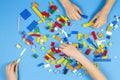 Vilnius, Lithuania - February 23, 2019. Children hands play with colorful lego blocks on the table Royalty Free Stock Photo