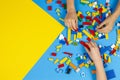 Vilnius, Lithuania - February 23, 2019. Children hands play with colorful lego blocks on the table Royalty Free Stock Photo