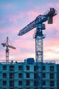 Worksite with cranes, new buildings or houses under construction Royalty Free Stock Photo