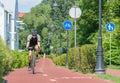 Boy with helmet cycling on the bike road