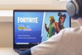 Vilnius, Lithuania - July 2, 2019: Boy playing Fortnite game. Fortnite is online video game developed by Epic Games