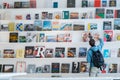 Unrecognizable man picking book from shelf