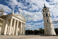 VILNIUS, LITHUANIA - JUNE 7, 2018: Vilnius Cathedral and Bell tower with white clouds in the blue sky and tourists in the square