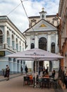 People have a lunch in a popular street cafe in Ausros vartu street of Vilnius, Lithuania
