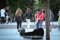 Vilnius, Lithuania - June 06 2022: Street musician in red shirt and a cowboy hat playing guitar in the street Royalty Free Stock Photo