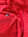 Tommy Hilfiger logo on red pants Royalty Free Stock Photo