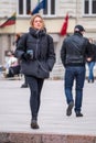 Beautiful blond girl without mask walking in the city