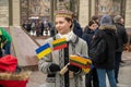 Pretty Lithuanian girl in traditional costume with Lithuanian and Ukrainian flags