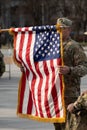 United States Marine Corps soldiers roll up American flag, USA Royalty Free Stock Photo