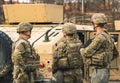 United States Marine Corps soldiers with weapons, helmets and armored vehicle humvee