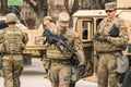 United States Marine Corps soldiers with weapons, helmets and armored vehicles humvee