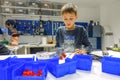 Vilnius, Lithuania - November 23, 2018: Kid making Lego robot mindstorms. Robotic, learning, technology, stem education Royalty Free Stock Photo