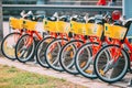 Vilnius, Lithuania. Row Of Colorful Bicycles AVIVA For Rent At Municipal Bike Parking In Street. Summer Day Royalty Free Stock Photo