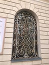 A beautiful motif of wrought iron covers the window of the Gate of Dawn Chapel of Mary the Mother of Mercy in Vilnius, Lithuania.