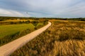 Hot air balloons low flying above country dirt road fields and forests in Lithuania Royalty Free Stock Photo