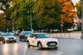 White Color Car Mini Cooper With Logo Citybee Moving On Street