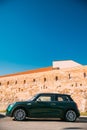 Vilnius, Lithuania. Side View Of Green Color Mini Cooper Car Parking Near Bastion Of Vilnius Defensive Wall Royalty Free Stock Photo