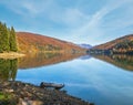 Vilshany water reservoir on the Tereblya river, Transcarpathia, Ukraine. Picturesque lake with clouds reflection. Beautiful autumn
