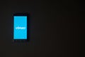 Vimeo logo on smartphone screen on black background.