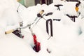 Vinage bike covered with big thick snow layer after blizzard at european city street in winter. Abandoned bicycle buried in Royalty Free Stock Photo