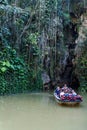 VINALES, CUBA - FEB 18, 2016: Tourists in a boat are leaving Cueva del Indio cave in National Park Vinales, Cub