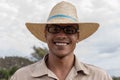 VINALES, CUBA - MARCH 14, 2018. Cuban with a white hat on a tobacco farm. Royalty Free Stock Photo