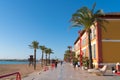 Vinaros Spain tourists and visitors enjoying a walk on the promenade beautiful sunshine