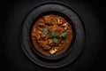 Vindaloo On Black Matte Plate. Generative AI