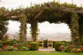 Vine Covered Patio and Chairs with Country View Royalty Free Stock Photo