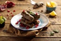 vine leaves with lemon slice served in a dish side view isolared on wooden table