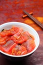 Vinegared rice topped with sliced raw tuna