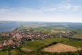 Vineyard near small village, blue sky, agriculture and wine. Look from above Royalty Free Stock Photo