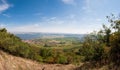 Vineyard near small village, blue sky, agriculture and wine Royalty Free Stock Photo