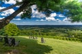 Vineyard overlook with rustic chairs and panoramic farmland view Royalty Free Stock Photo