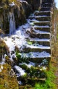 Crooked stone stairs to the vineyard with snow and grass Royalty Free Stock Photo