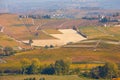 Vineyards, fields and hills in autumn with yellow leaves in Piedmont, Italy