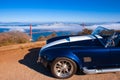 Vingtage classic sport car with San Francisco Golden Gate bridge Royalty Free Stock Photo