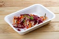 Vinigret salad. Vegetarian food. Takeaway food. On a wooden background Royalty Free Stock Photo