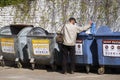 Tramp looking for food and things of garbage containers Royalty Free Stock Photo