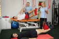 Physiotherapy: Exercise under supervision of physiotherapist. Treatment of pain in the spine with Red Cord equipment Royalty Free Stock Photo