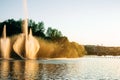 Vinnitsa, Ukraine. Color fountain on the lake in summer sunny day. Dancing fountain on green park background. Fountains show Royalty Free Stock Photo