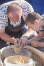 Vinnitsa, Ukraine - September 14, 2019: a potter craftsman transfers his skills to a student