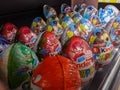 Multicolored kinder surprises lie on the shelf Royalty Free Stock Photo