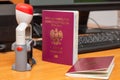 Vinous biometric passport of a Polish citizen with a border date stamper, close-up. Inscription - European Union, Republic of