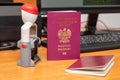 Vinous biometric passport of a Polish citizen with a border date stamper, close-up. Inscription - European Union, Republic of