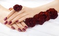 Vinous manicure with rose flowers. spa